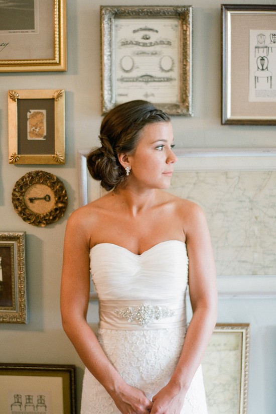 Elegant bride in strapless gown with braided updo hairstyle