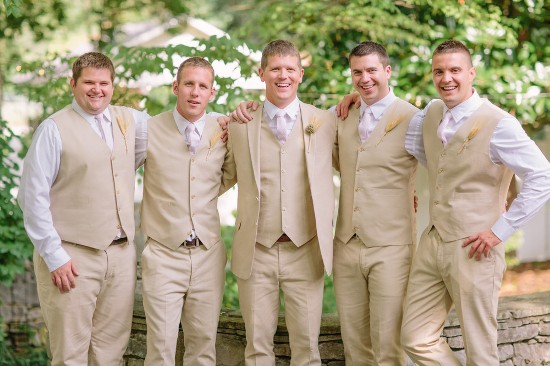 Groomsmen in tan suits at outdoor wedding portrait