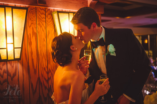 Romantic wedding couple kissing, toasting champagne