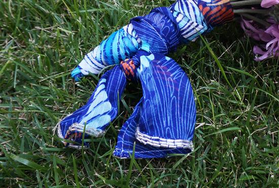 Blue patterned fabric bouquet wrap on grass