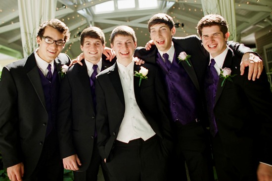 Groom and groomsmen in black tuxedos