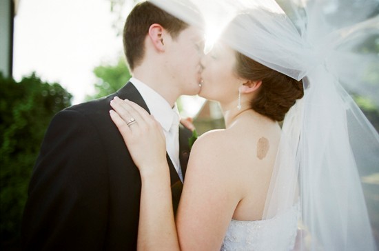 Couple kissing, wedding day love