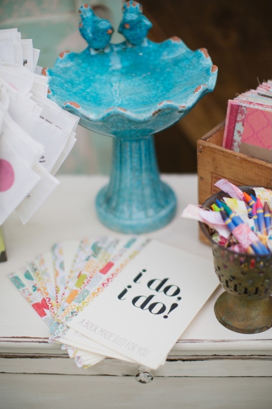 Wedding guest book station with turquoise birdbath