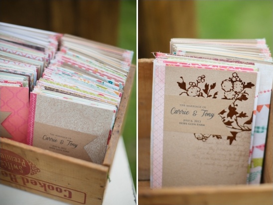 Wedding programs in a wooden crate for Carrie and Tony