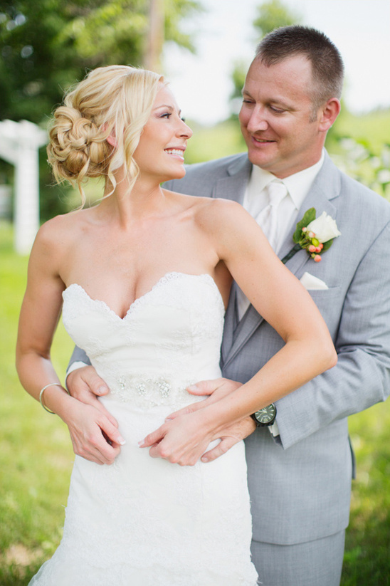 Happy bride and groom embracing on their wedding day