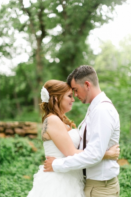 Couple in wedding attire, loving embrace