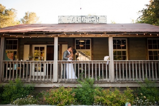 Couple kissing on rustic porch