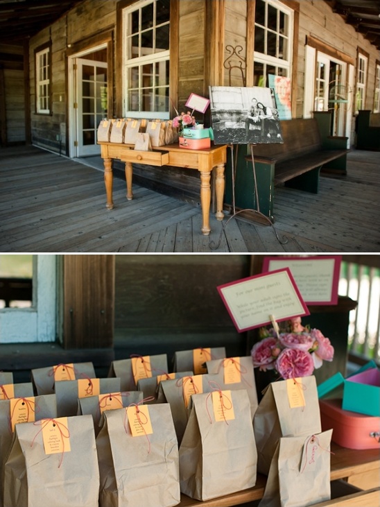 Favors in brown paper bags at outdoor wedding reception