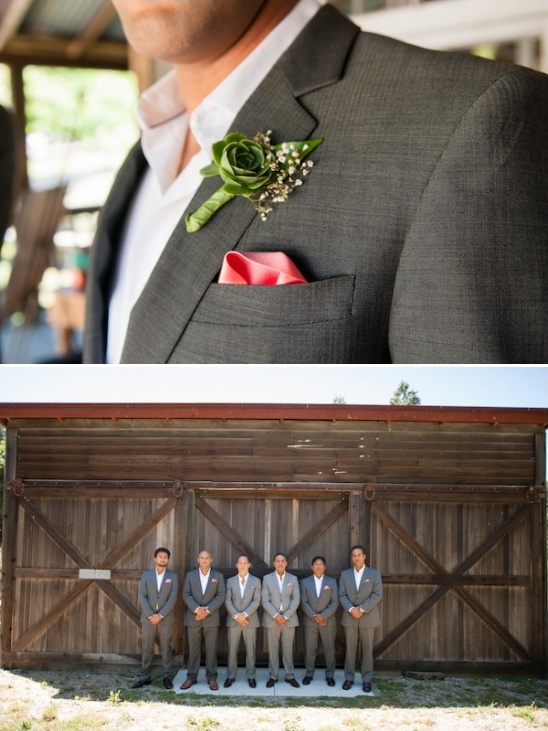 Groomsmen in gray suits with boutonnieres at wedding