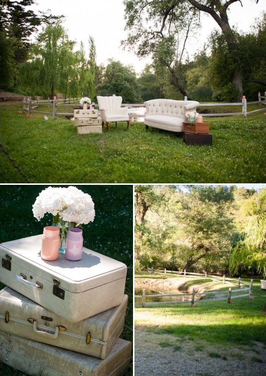 Outdoor wedding lounge area with vintage suitcases