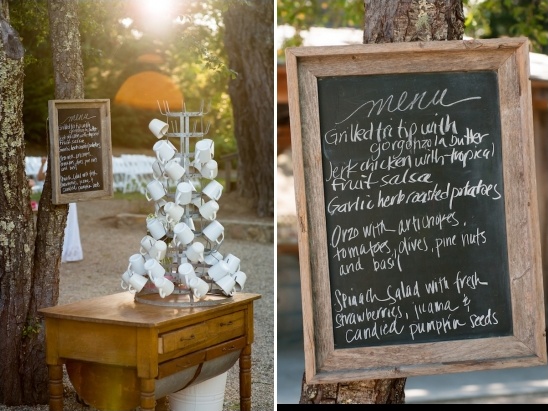 Outdoor wedding with menu chalkboard and mug tree
