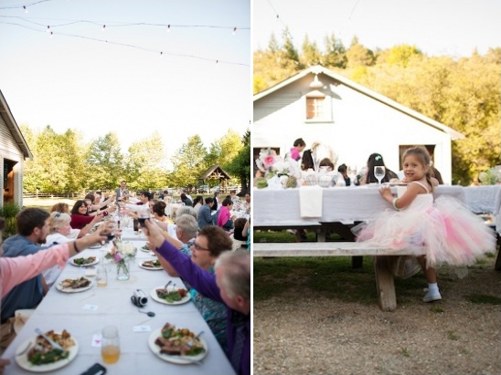 Outdoor wedding reception guests toast and little girl in tutu