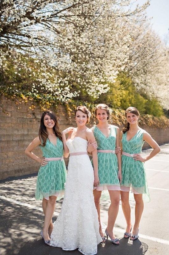 Bride and bridesmaids in mint dresses outdoors