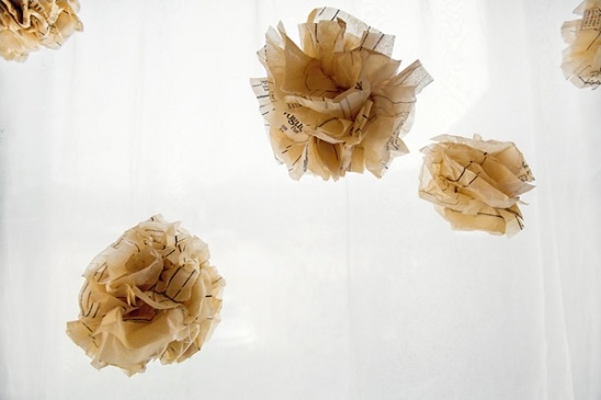 Paper pattern pom-poms hanging decoratively
