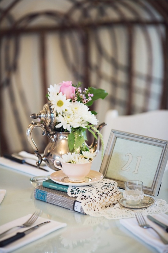 Elegant table number 21 with floral teapot centerpiece