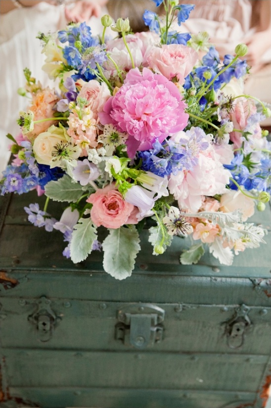 colorful floral arrangement by embellished blooms