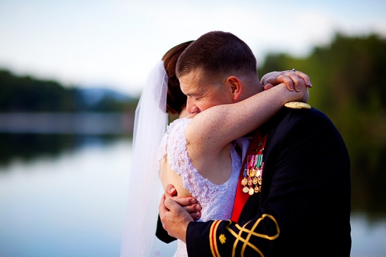 Loving couple embracing near water
