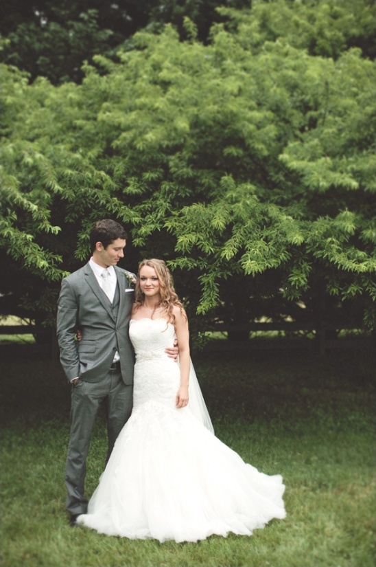 Happy bride and groom posing for a wedding photograph