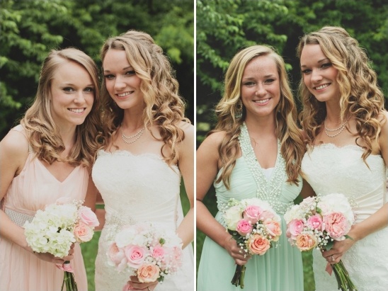 Bridesmaids in pastel dresses holding wedding bouquets smiling