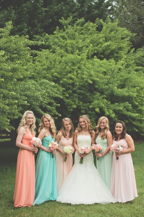 Bride and bridesmaids in colorful gowns, wedding day celebration