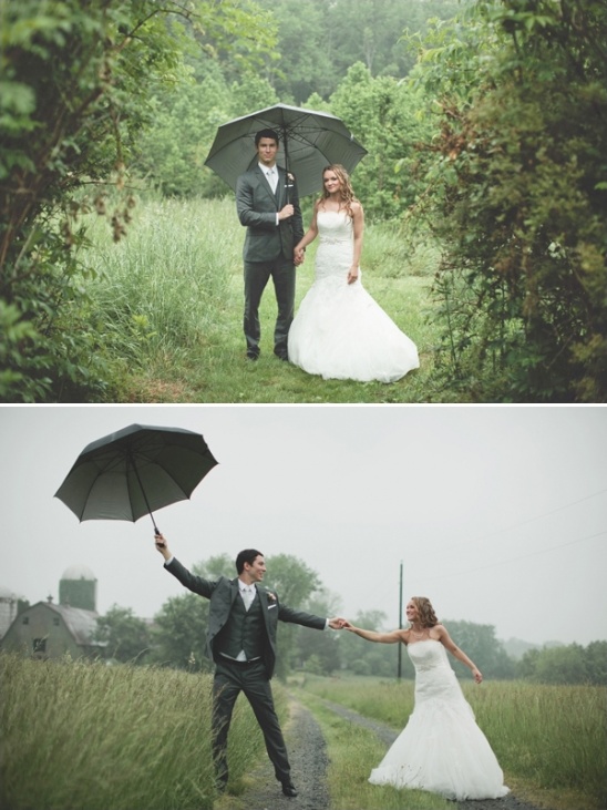 Happy couple embraces the rain on their wedding day