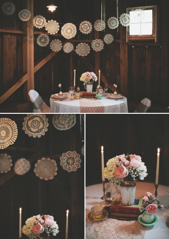 Rustic wedding table setting with doily decor and flowers