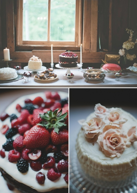 Delicious cakes with berries and flowers on a table