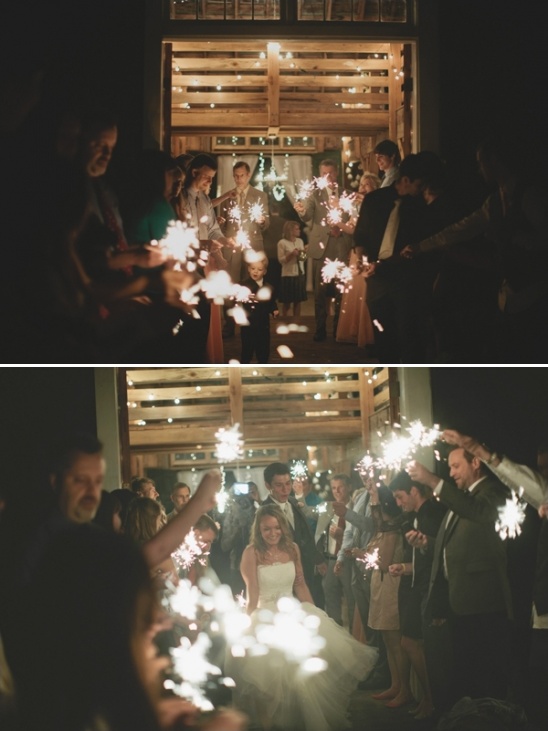 Bride and groom exit wedding under sparklers, beautiful moment