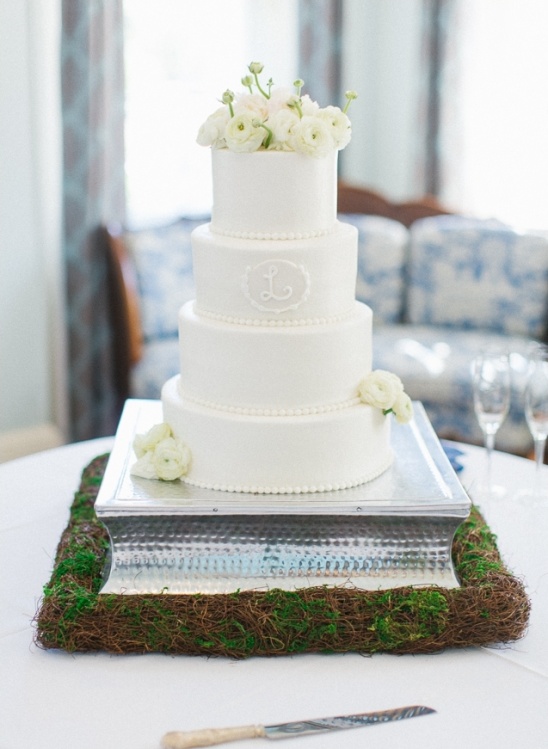elegant white wedding cake by couture cakes