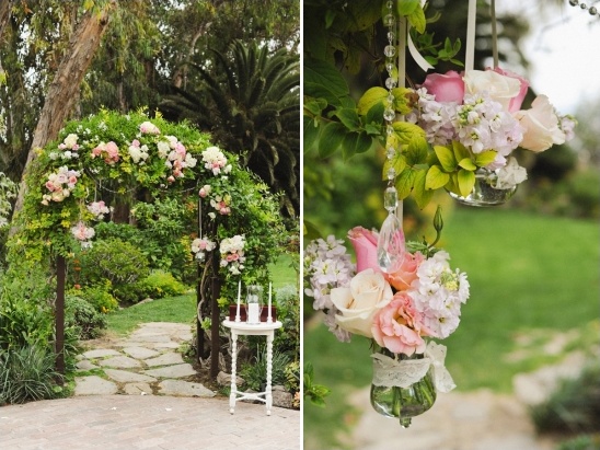 hanging florals on wedding arch