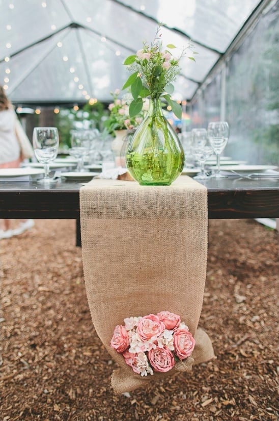 burlap table runner with flower bouquet