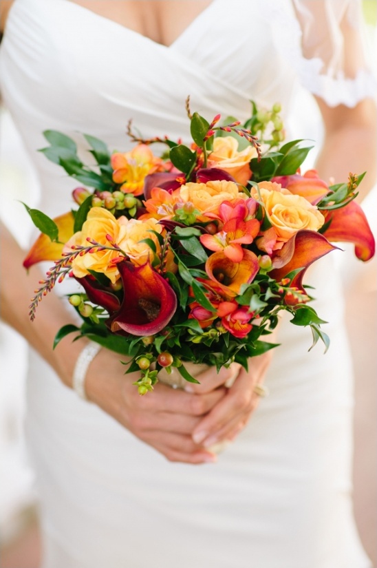 orange and yellow bouquet by festive designs
