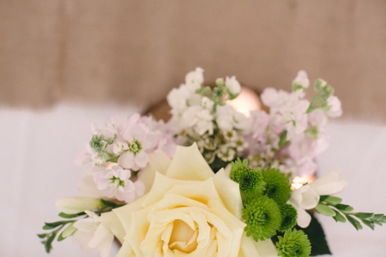 Elegant floral arrangement with a soft cream rose and greenery