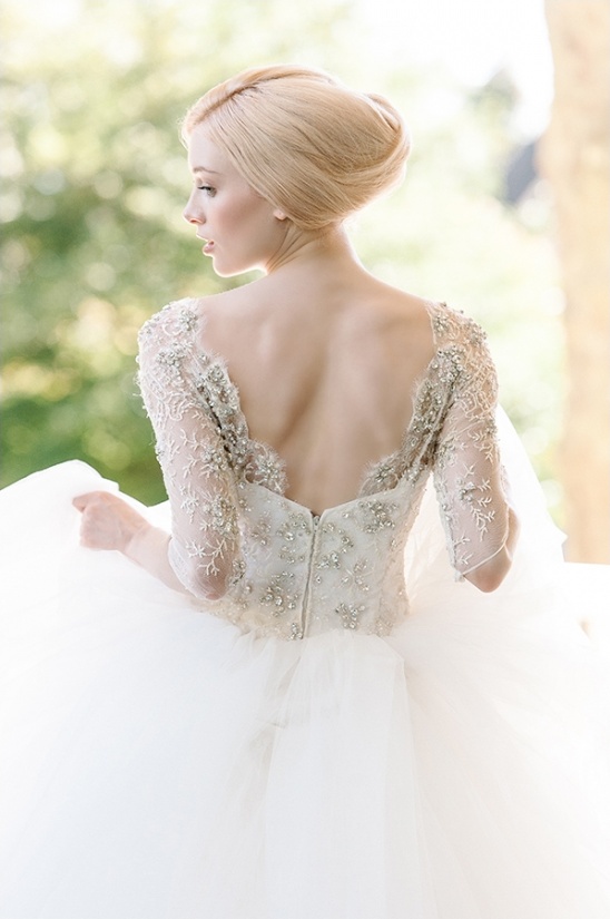 Elegant bride in a detailed wedding dress, back view