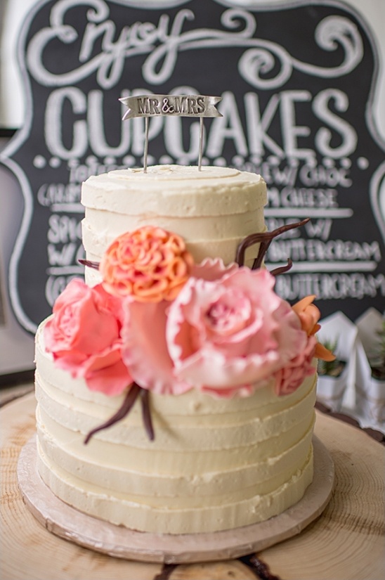 flower accented wedding cake by sugar cubed cake creations