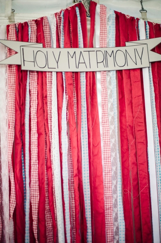 Festive ribbons decorate a wedding background that says Holy Matrimony