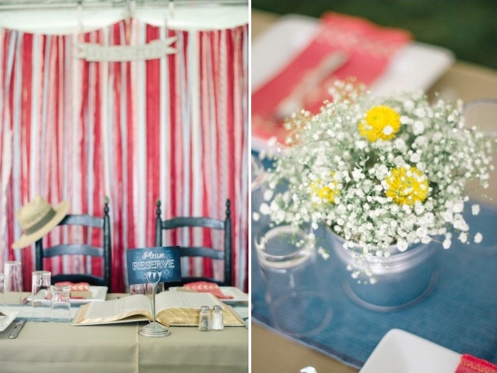 Wedding table decor with striped backdrop and flower arrangement
