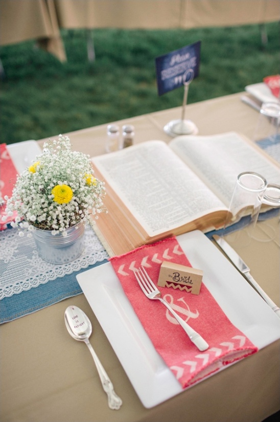 Wedding table setting with floral, book and a lovely spoon