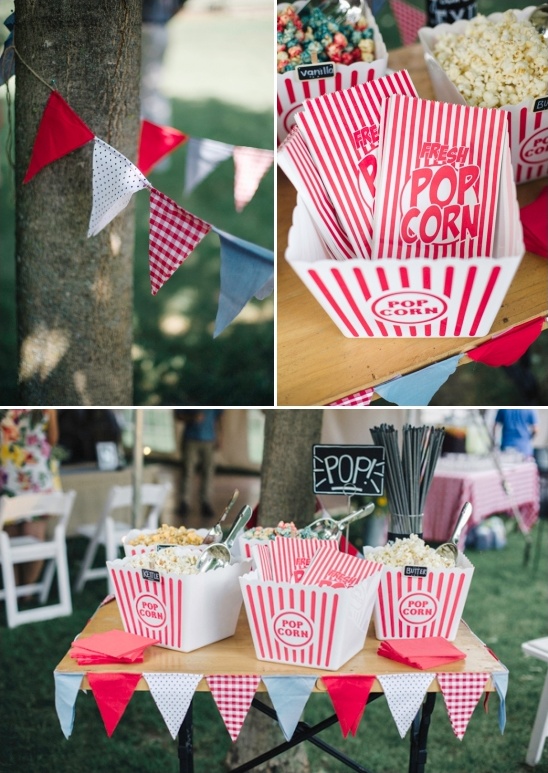 Popcorn station with festive pennants perfect for outdoor event