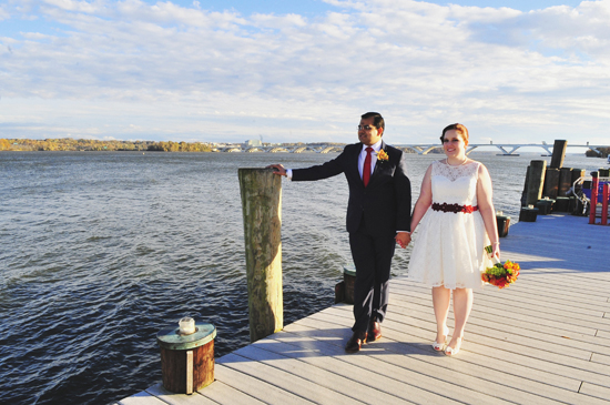 Happy couple married by the water