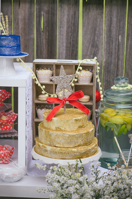 glittery gold wedding cake with silver star cake topper