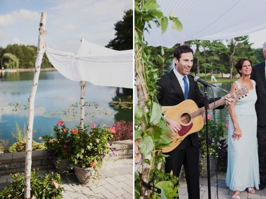 Wedding ceremony outdoors by lake with musician