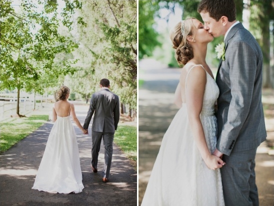 Couple walking and kissing on wedding day