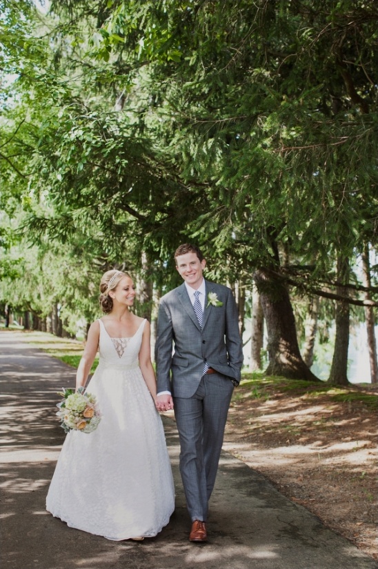 Bride and groom stroll on their wedding day path