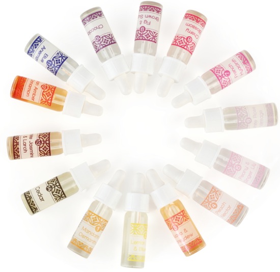 Assortment of essential oil droppers arranged in a circular pattern