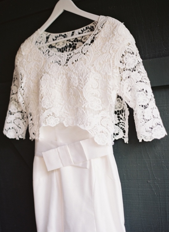 Elegant white dress with lace bolero on hanger