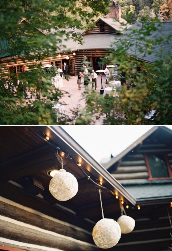 Outdoor wedding at rustic log cabin venue with lights