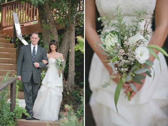 Bride and father walking down aisle, wedding bouquet