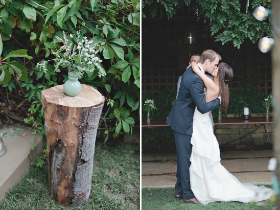 Rustic wedding ceremony: floral arrangement and kiss
