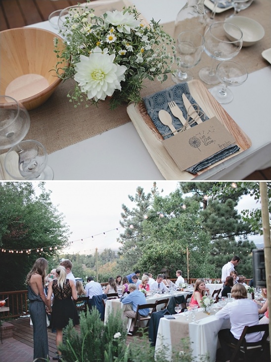 Outdoor wedding reception with floral centerpiece and guests